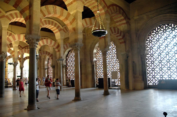 Arches of Mosque of Cordoba leading to Orange Tree Courtyard - light filters through semi transparent materials.