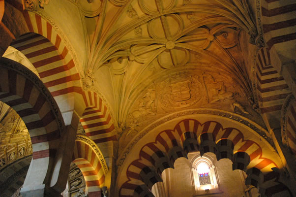 These ceilings, and those in aisle to left, are gothic in style, and lead up to the Villaviciosa Chapel.