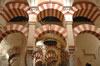Double tiers of arches and carved wood ceilings in the Mosque of Cordoba - see our photo album